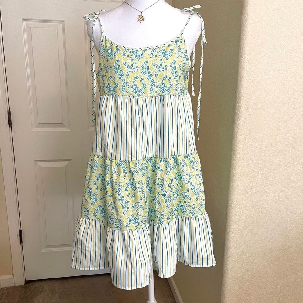 Blue and yellow floral and striped tiered dress with ruffles and tie straps